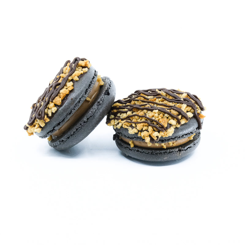 Tim tam Macaron with chocolate drizzled on top and sprinkled nuts